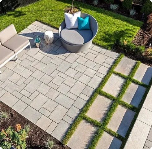 Alpha Hardscapes project featuring a natural stone walkway surrounded by greenery